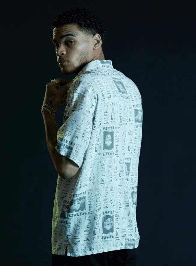Moon Knight Scarab button up / shop it <a href=https://www.hottopic.com/product/our-universe-marvel-moon-knight-scarab-woven-button-up/17194866.html>here</a>