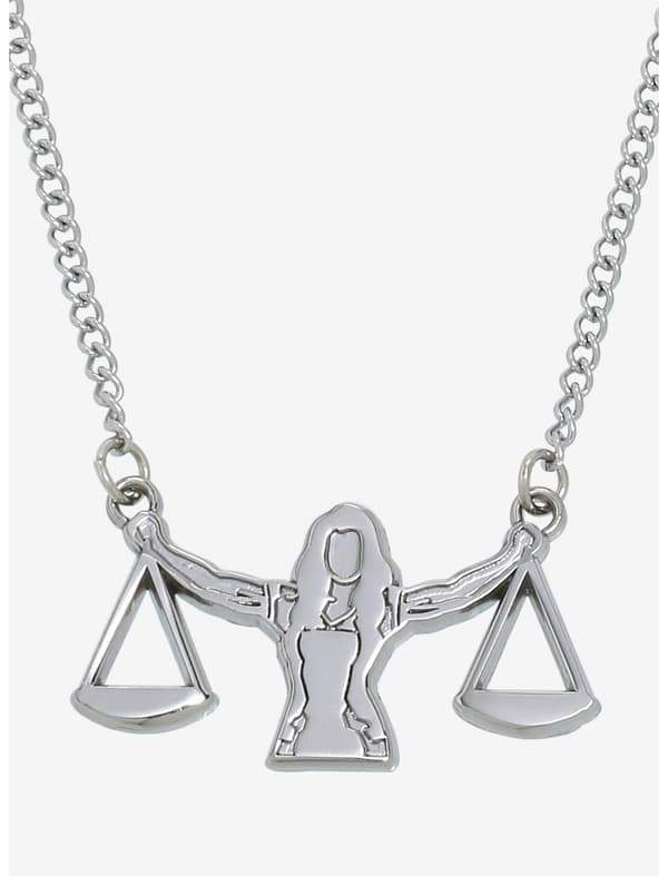 She-Hulk scale necklace / shop it <a href= https://www.hottopic.com/product/marvel-she-hulk-attorney-at-law-justice-scale-necklace/19568490.html>here</a>
