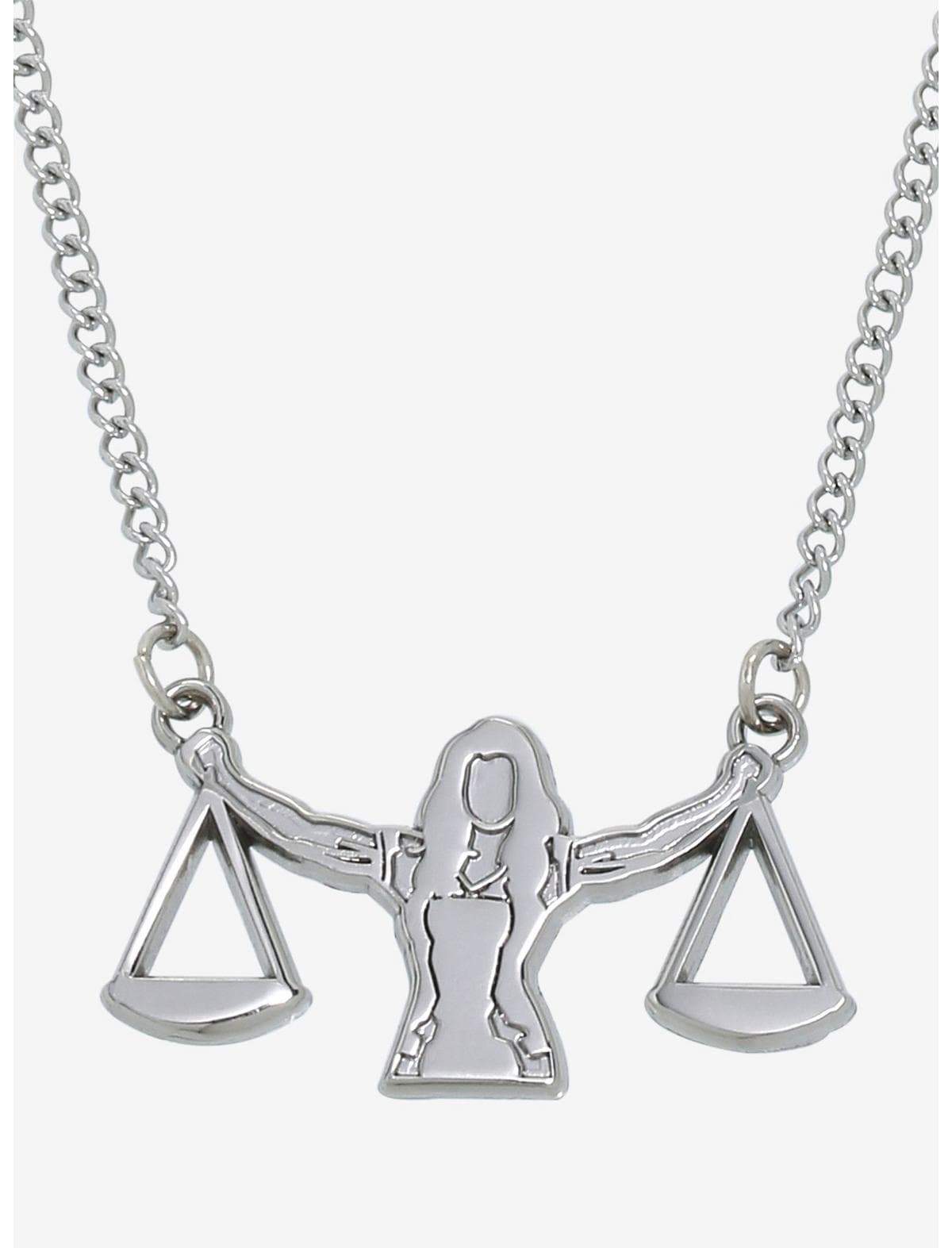 She-Hulk scale necklace / shop it <a href= https://www.hottopic.com/product/marvel-she-hulk-attorney-at-law-justice-scale-necklace/19568490.html>here</a>