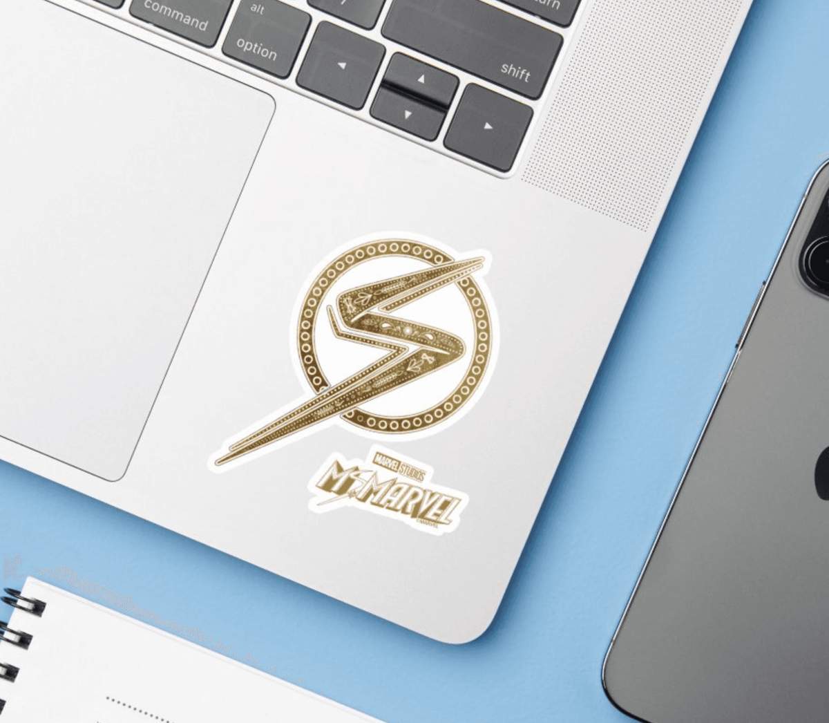 Ms. Marvel sticker / shop it <a href=https://www.zazzle.com/ms_marvel_ornate_pattern_logo_sticker-256493302521350802>here</a>