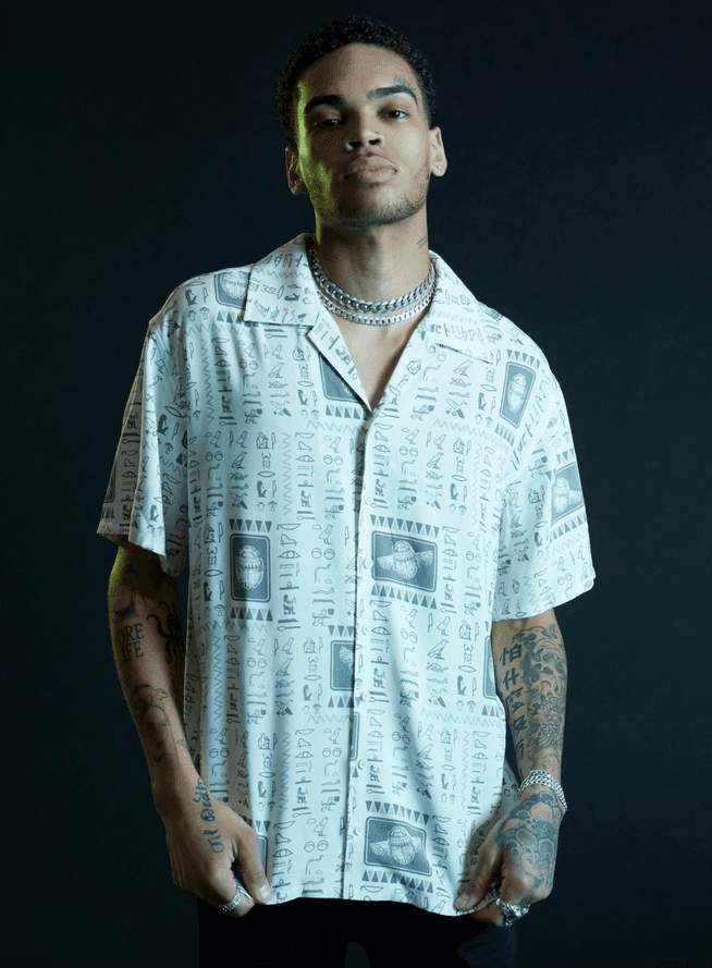 Moon Knight Scarab button up / shop it <a href=https://www.hottopic.com/product/our-universe-marvel-moon-knight-scarab-woven-button-up/17194866.html>here</a>